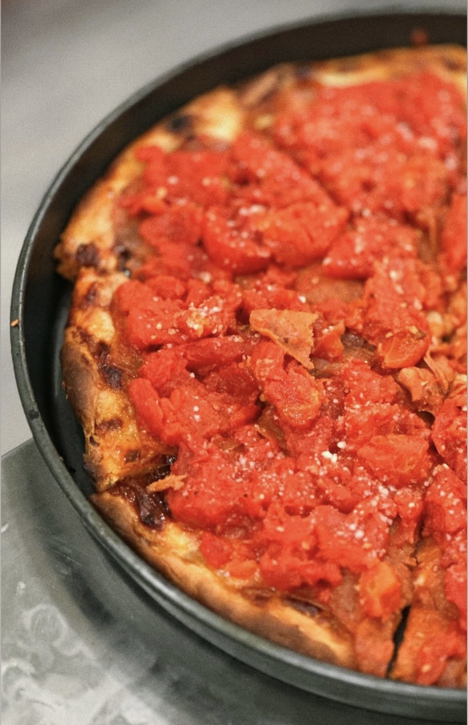 Chicago deep dish special with crushed tomato on top, baked with zero flop
